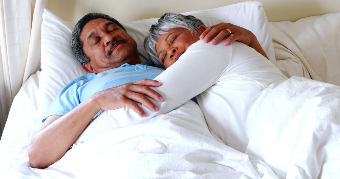 Middle-aged Couple Resting Peacefully Together in Bed