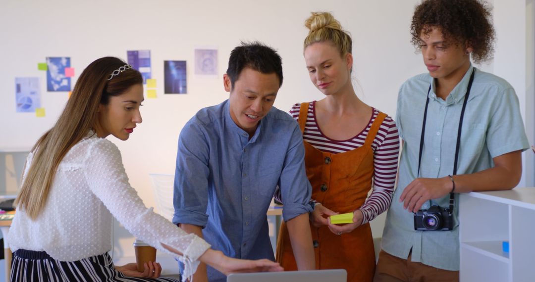 Collaborative Team Analyzing Project in Bright Modern Office
