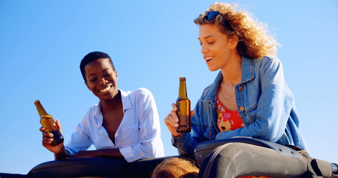 Friends Enjoying Beers on a Sunny Day - Free Images, Stock Photos and Pictures on Pikwizard.com