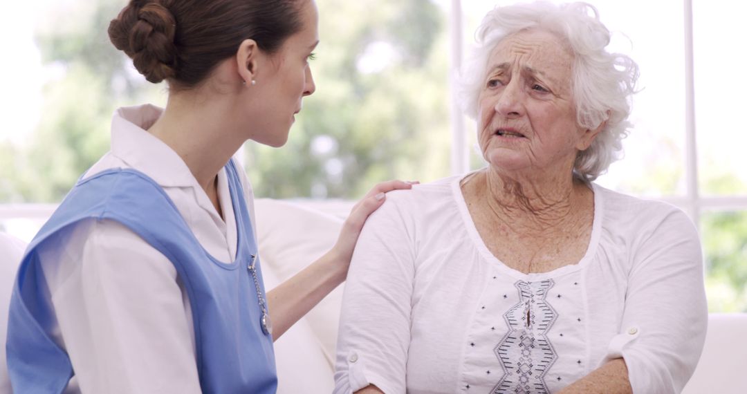 Nurse Comforting Elderly Woman, Caregiver Offering Support - Free Images, Stock Photos and Pictures on Pikwizard.com