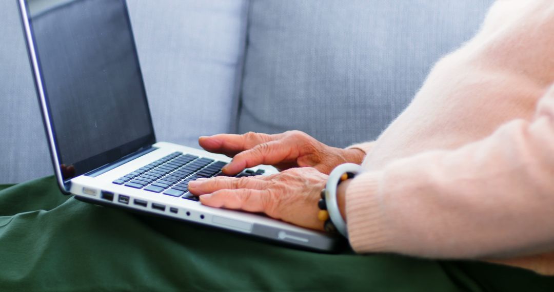 Senior Woman Using Laptop on Couch, Close-Up - Free Images, Stock Photos and Pictures on Pikwizard.com