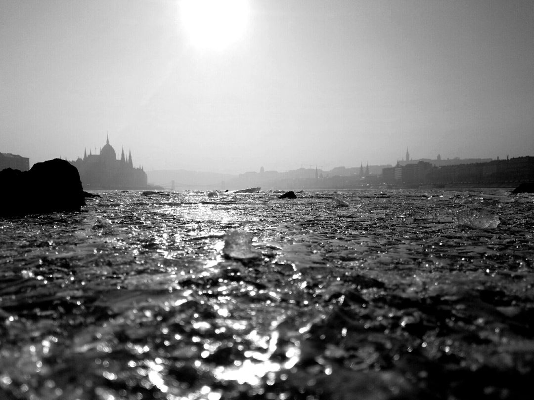 Silhouette of Budapest Parliament at Sunrise Over Danube River - Free Images, Stock Photos and Pictures on Pikwizard.com