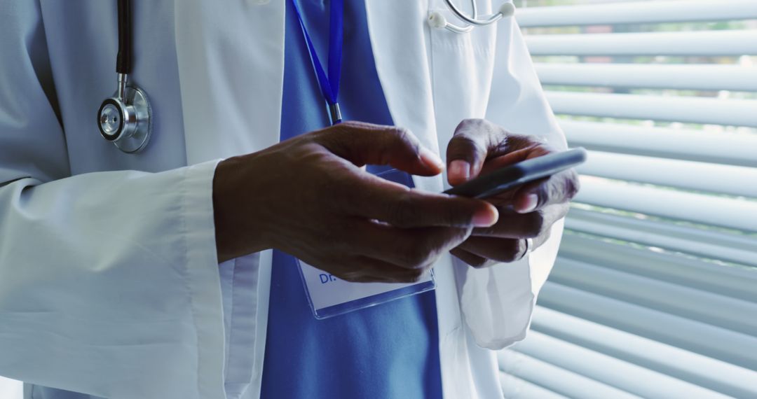 Doctor Texting on Smartphone in Clinic Office - Free Images, Stock Photos and Pictures on Pikwizard.com