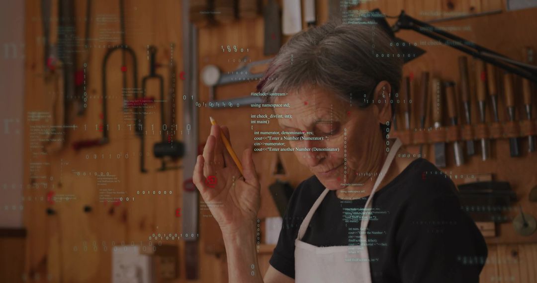 Senior craftswoman inspecting woodwork, jotting notes in workshop with code overlay