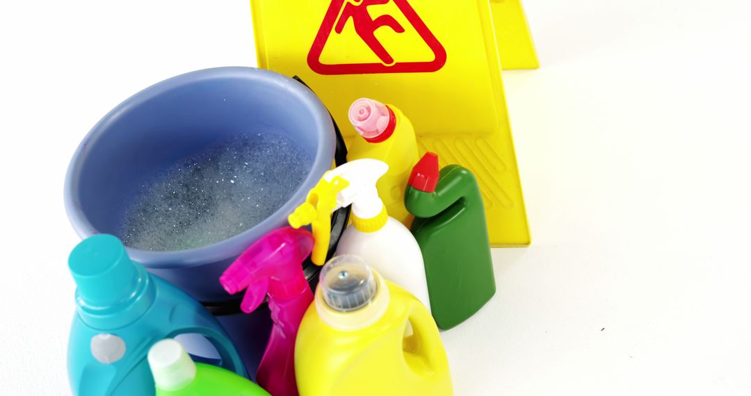 Cleaning Supplies and Warning Sign on White Background - Free Images, Stock Photos and Pictures on Pikwizard.com