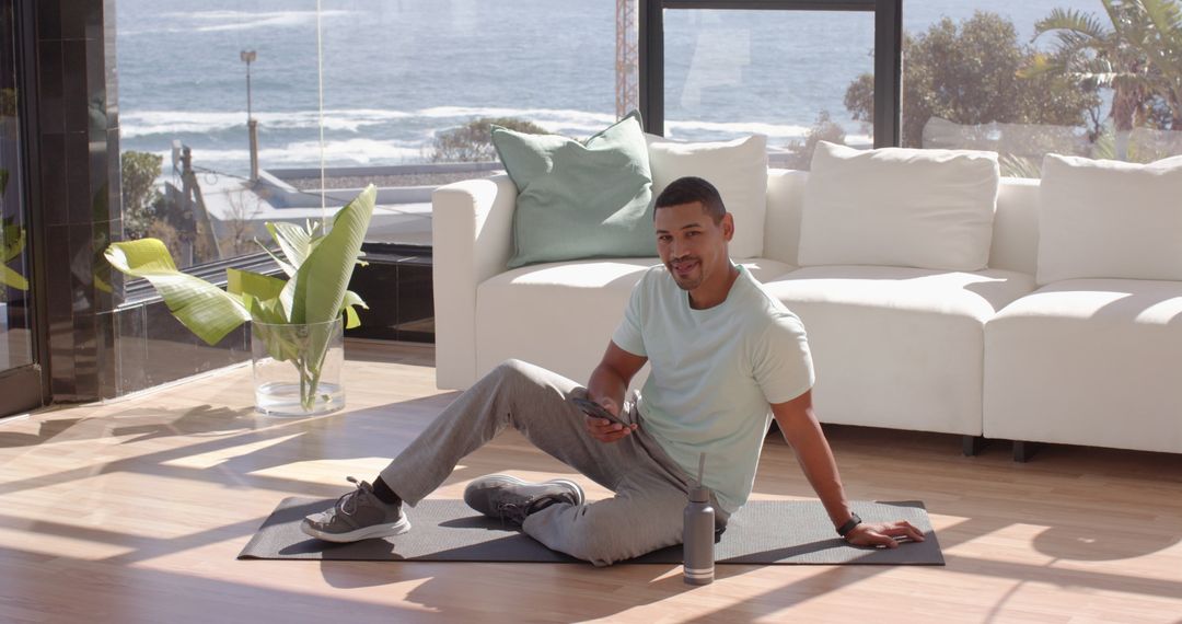 Man Practicing Wellness Routine at Serene Oceanfront Home