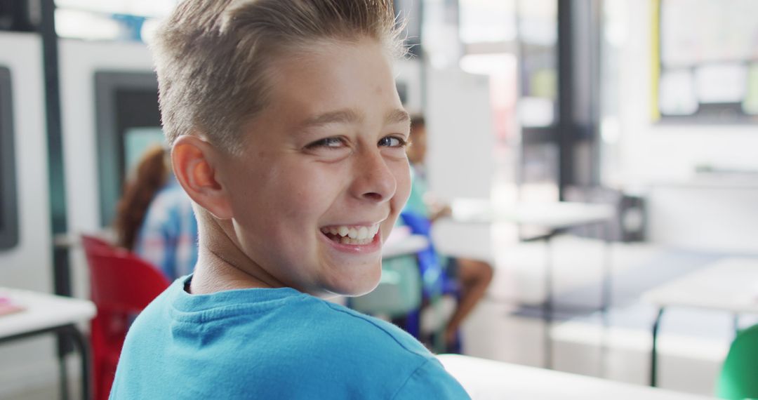 Smiling Schoolboy in Classroom Showing Enjoyment of Learning