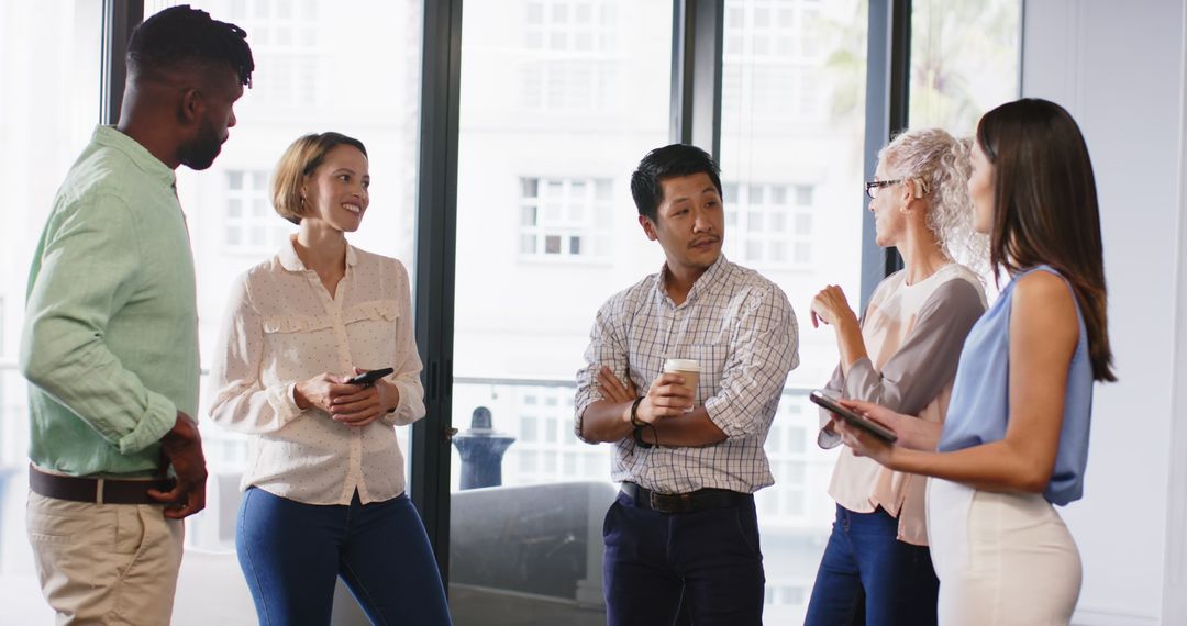 Diverse Team Collaborating on Project Ideas in Modern Office