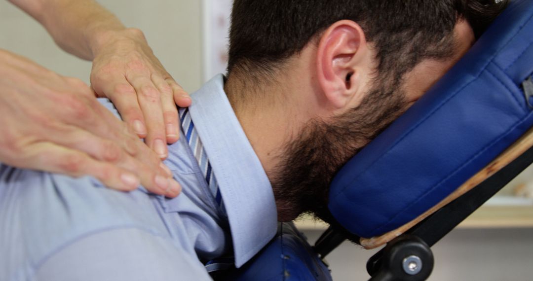 Physiotherapist Performing Therapeutic Back Massage on Client - Free Images, Stock Photos and Pictures on Pikwizard.com