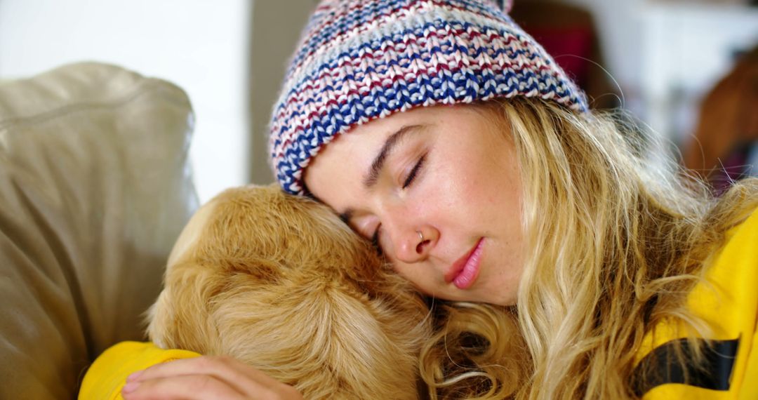 Woman Napping with Dog in Cozy Winter Hat - Free Images, Stock Photos and Pictures on Pikwizard.com