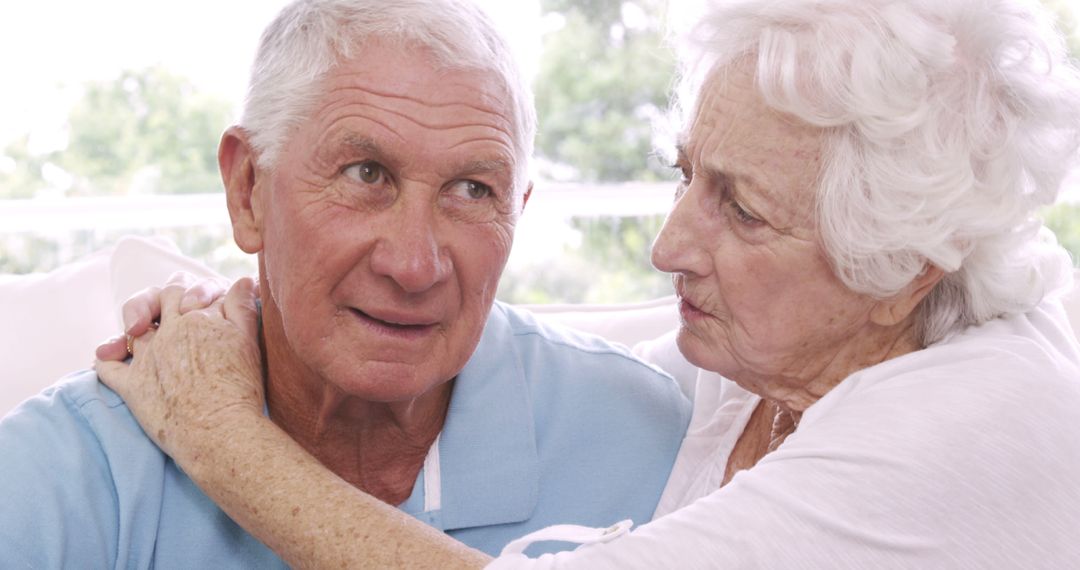 Elderly Couple Sharing an Emotional Moment at Home - Free Images, Stock Photos and Pictures on Pikwizard.com