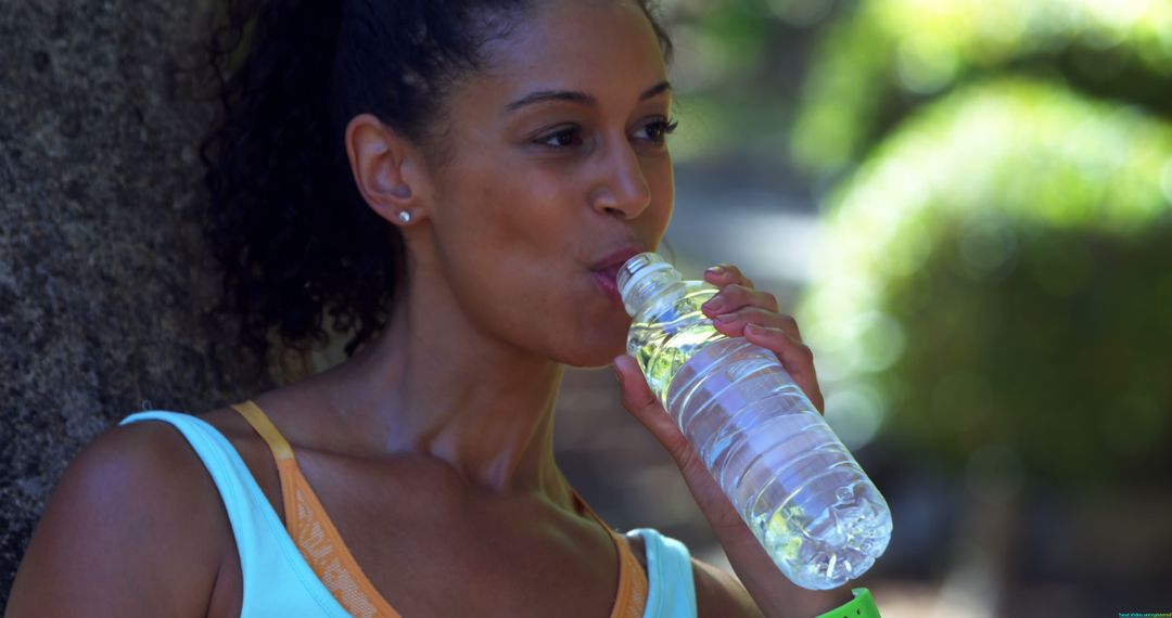 Young Woman Hydrating during Outdoor Workout - Free Images, Stock Photos and Pictures on Pikwizard.com