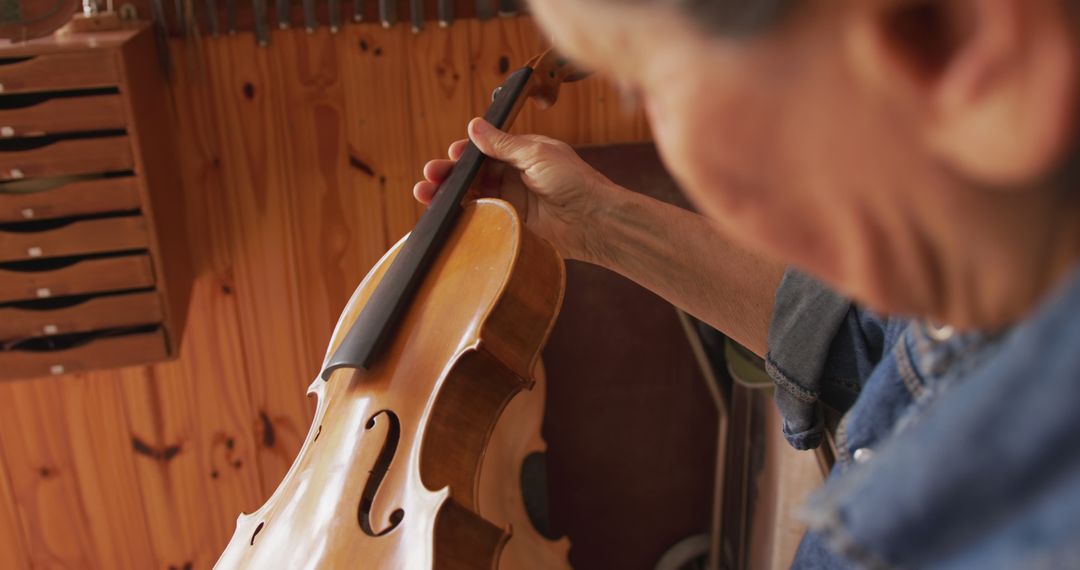 Close-up of Luthier Working on Violin Crafting in Wood Workshop - Free Images, Stock Photos and Pictures on Pikwizard.com