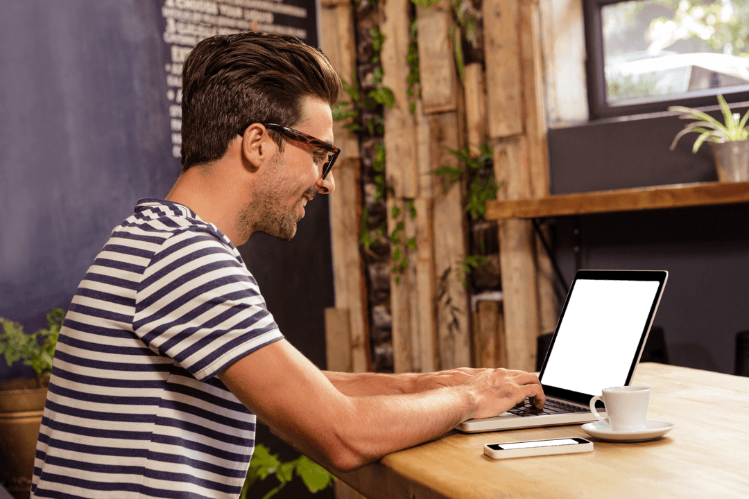 Transparent Bootstrap Enjoying Coffee at Cozy Cafe with Laptop