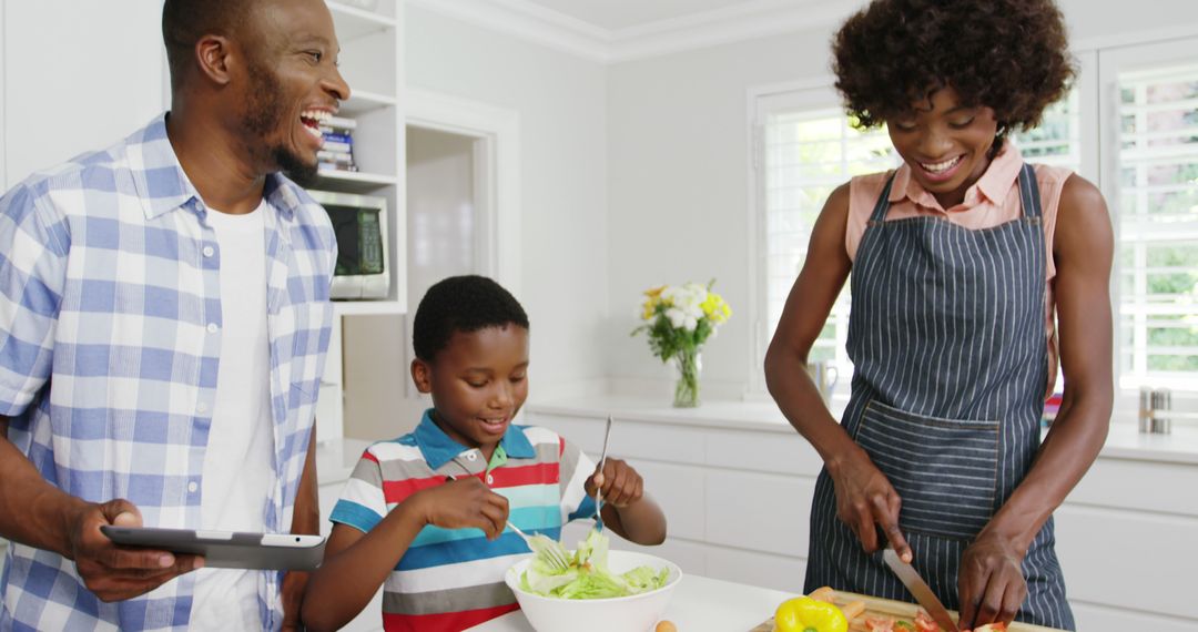 Happy African American Family Preparing Healthy Meal in Modern Kitchen - Free Images, Stock Photos and Pictures on Pikwizard.com