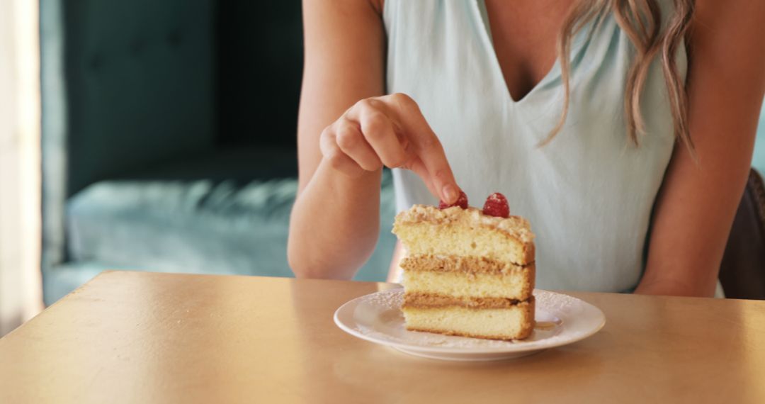 Woman Enjoying Slice of Cake in Cafe - Free Images, Stock Photos and Pictures on Pikwizard.com