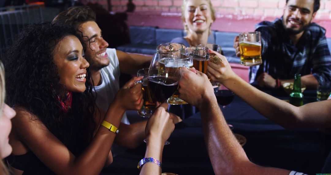 Diverse Group Celebrating with Drinks at Social Gathering