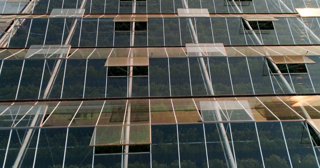 Reflective glass windows on a modern building facade create an abstract pattern, with copy space - Free Images, Stock Photos and Pictures on Pikwizard.com