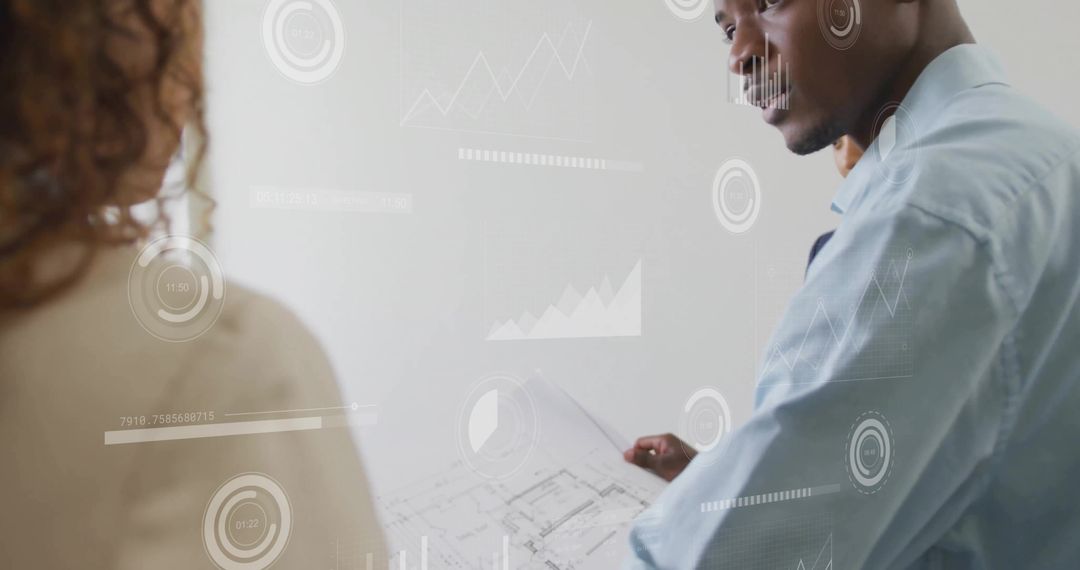 Male Architect Holding Blueprint with Digital Charts