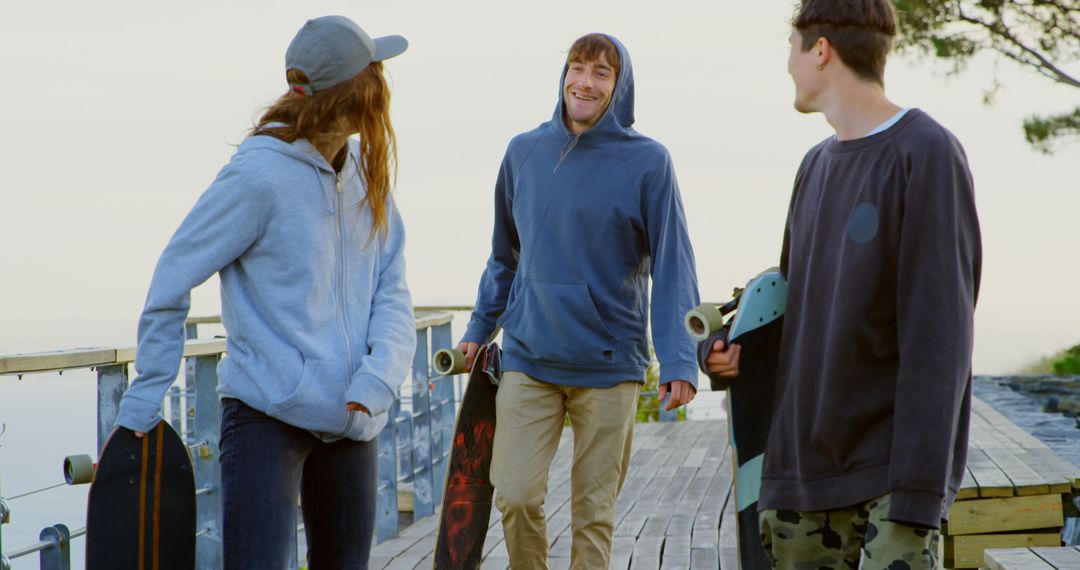 Friends Enjoying Skateboarding Outdoors on Sunny Day - Free Images, Stock Photos and Pictures on Pikwizard.com