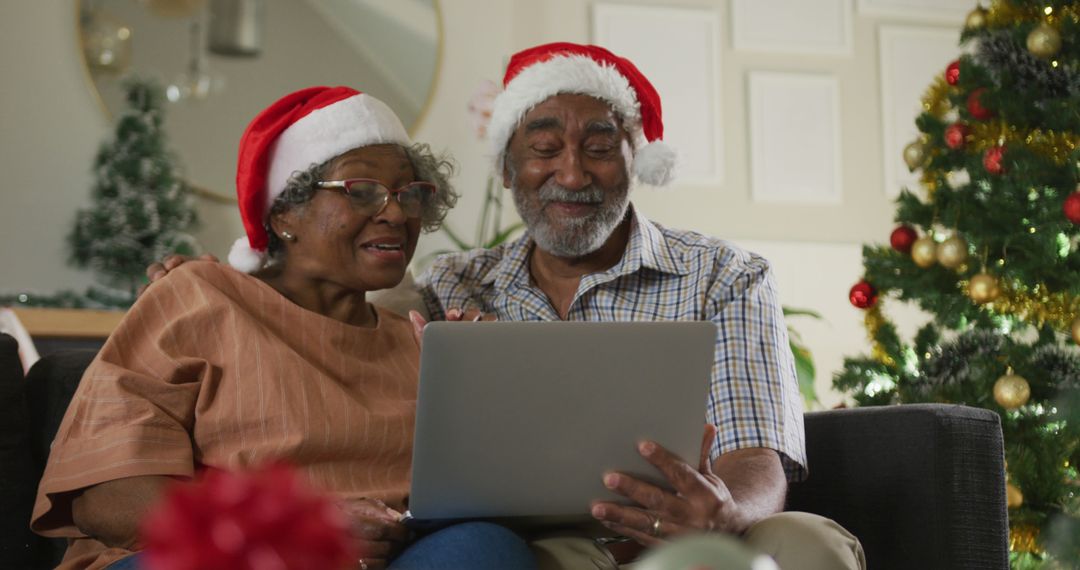 Image of happy african american senior couple having image call at christmas time - Free Images, Stock Photos and Pictures on Pikwizard.com