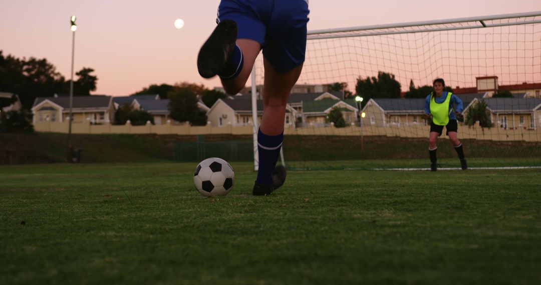 Soccer Player Taking Kick at Goal During Twilight - Free Images, Stock Photos and Pictures on Pikwizard.com