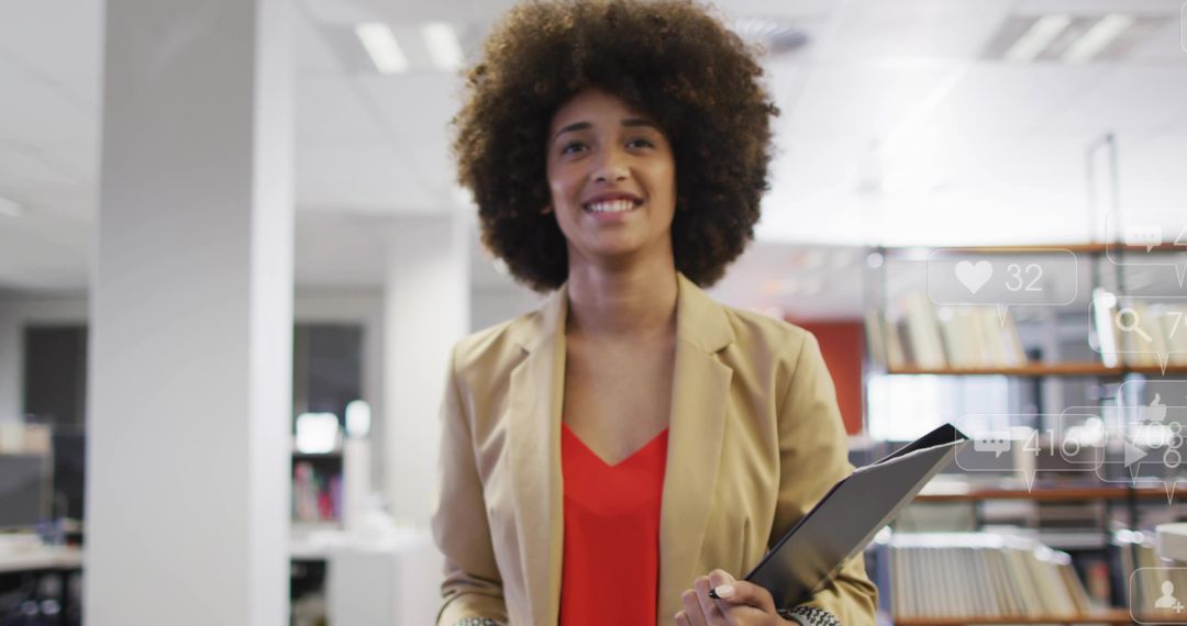 Confident businesswoman holding tablet smiling in modern office with digital overlays