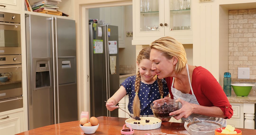 Caucasian Mother and Daughter Baking Together in Cozy Home Kitchen - Free Images, Stock Photos and Pictures on Pikwizard.com