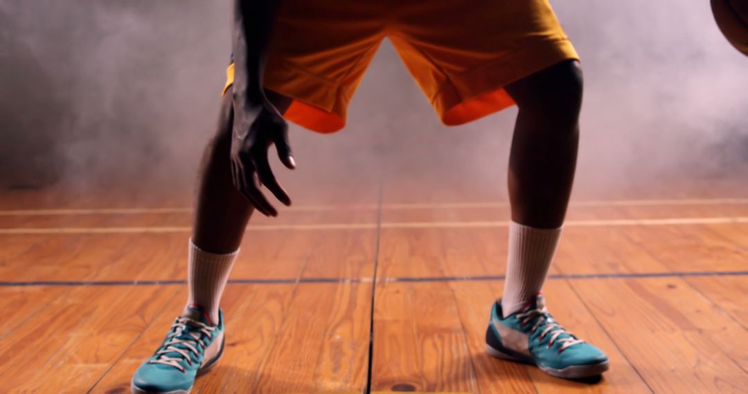 Basketball Player in Action on Indoor Court with Fog - Free Images, Stock Photos and Pictures on Pikwizard.com