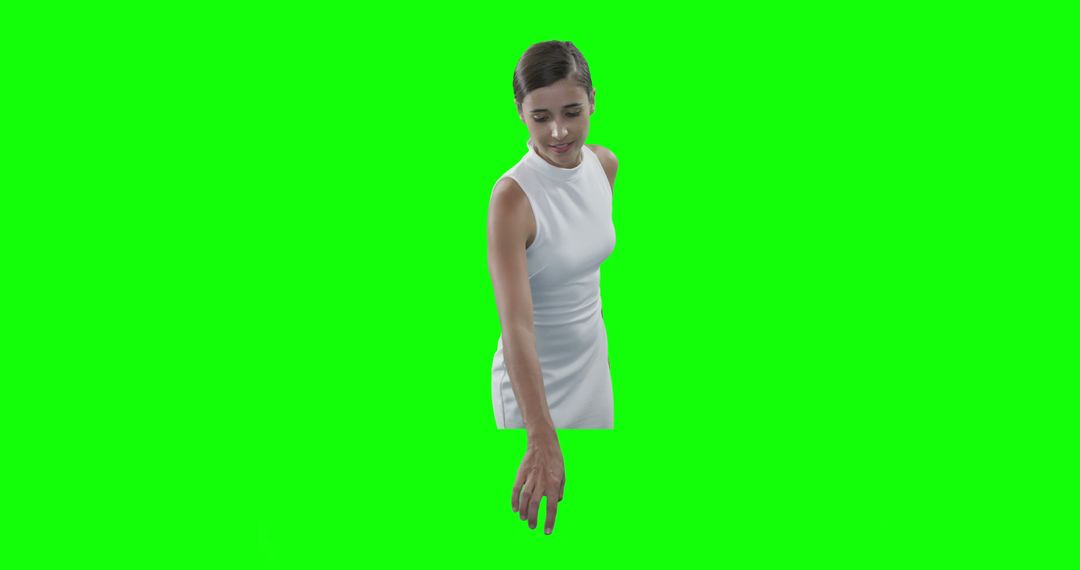 Woman Pointing Down Against Green Screen - Free Images, Stock Photos and Pictures on Pikwizard.com