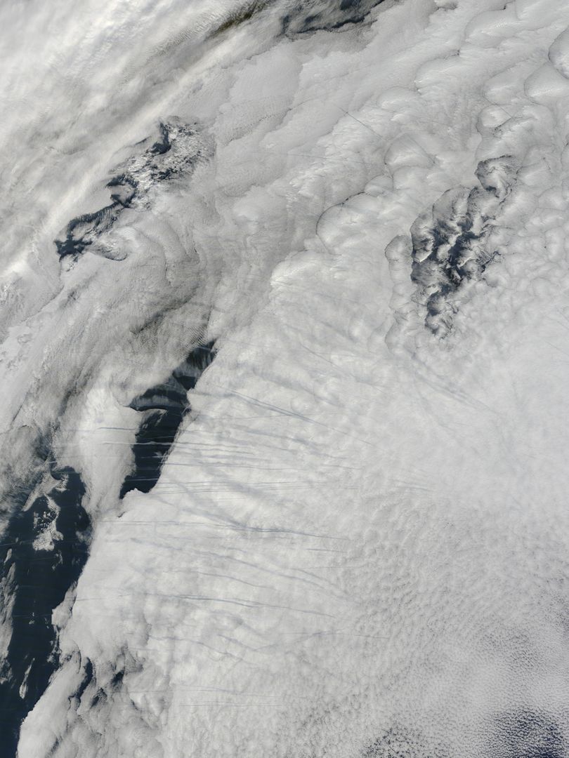 Satellite Image Captures Contrails over Clouds in North Atlantic Ocean - Free Images, Stock Photos and Pictures on Pikwizard.com