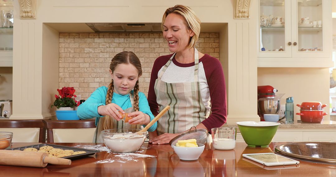 Mother and Daughter Baking Cookies Together at Home Kitchen - Free Images, Stock Photos and Pictures on Pikwizard.com