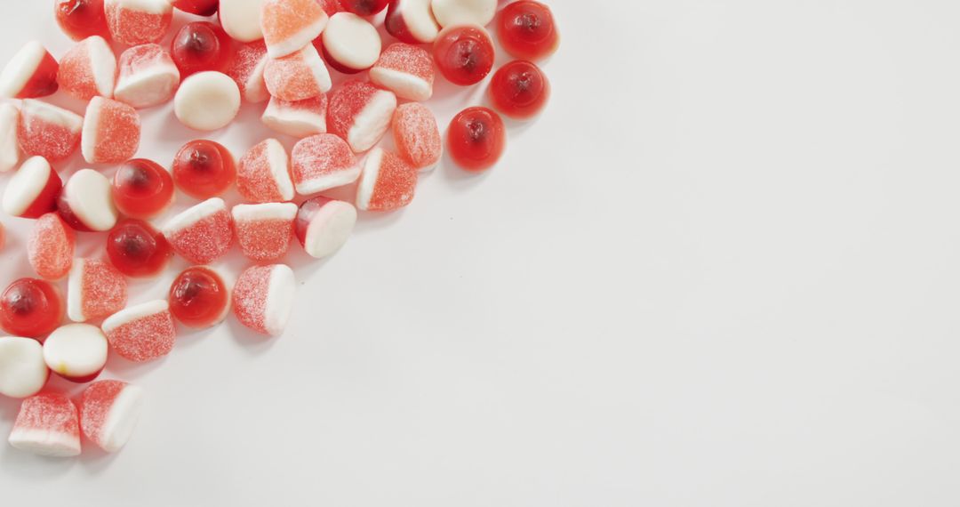 Assortment of Red and White Gummy Candies on White Background - Free Images, Stock Photos and Pictures on Pikwizard.com