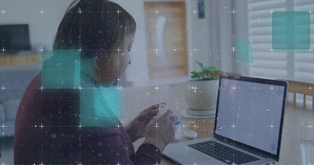 Person Opening Container While Working on Laptop in Minimalist Home Office