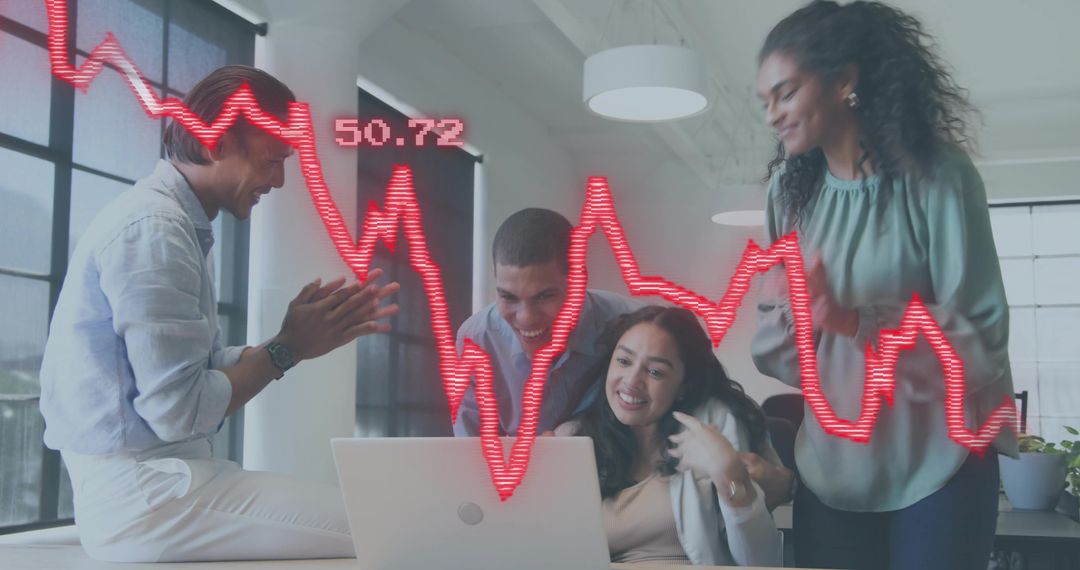 Diverse team celebrating stock market spike on laptop with red analytics chart overlay