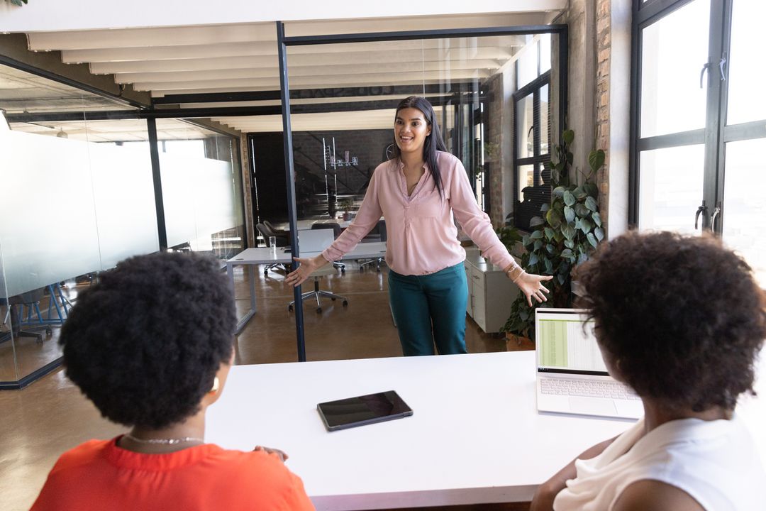 Diverse Coworkers Collaborating in Modern Office Meeting