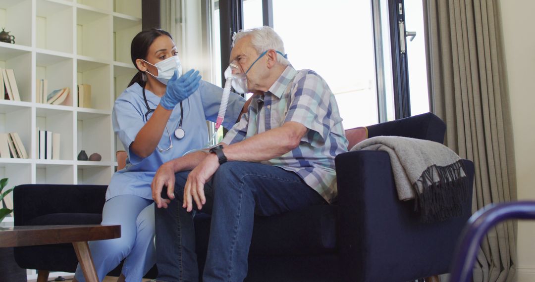 Healthcare Worker Assisting Senior Man with Oxygen Mask at Home - Free Images, Stock Photos and Pictures on Pikwizard.com