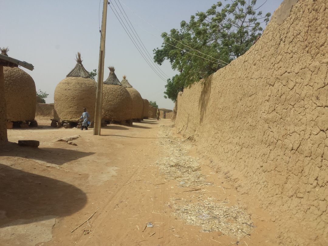 Rural Village Street with Traditional Clay Huts and Mud Walls - Free Images, Stock Photos and Pictures on Pikwizard.com