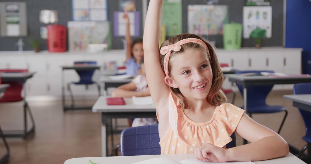 Smiling Girl Raising Hand in Classroom - Free Images, Stock Photos and Pictures on Pikwizard.com