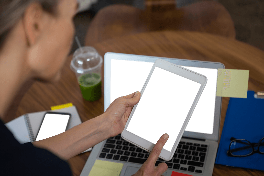 Transparent Mockup with Businesswoman Using Tablet and Laptop