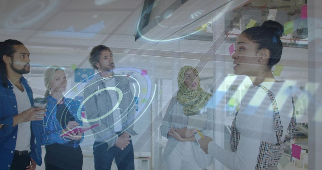 Colleagues Engaged in Brainstorming with Modern Digital Interface