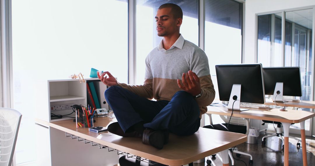 Young Businessman Practicing Mindfulness Meditation at Work - Free Images, Stock Photos and Pictures on Pikwizard.com