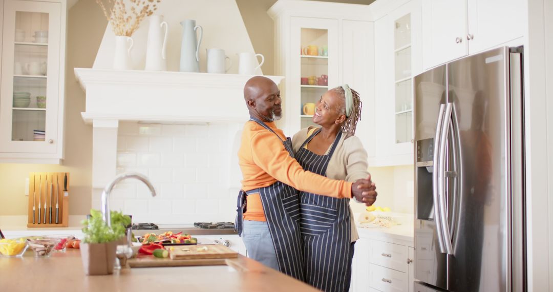 Senior Couple Dancing in Kitchen While Cooking Together - Free Images, Stock Photos and Pictures on Pikwizard.com