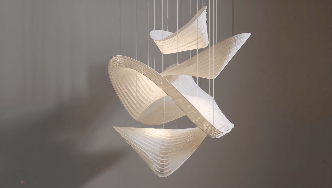 Floating Sculptural Pendant Lighting with Translucent Ribbed Panels Glowing Warmly Hanging on Thin C