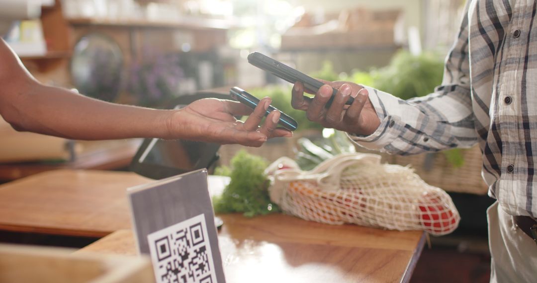 Person Making Contactless Payment with Smartphone at Farmers Market - Free Images, Stock Photos and Pictures on Pikwizard.com