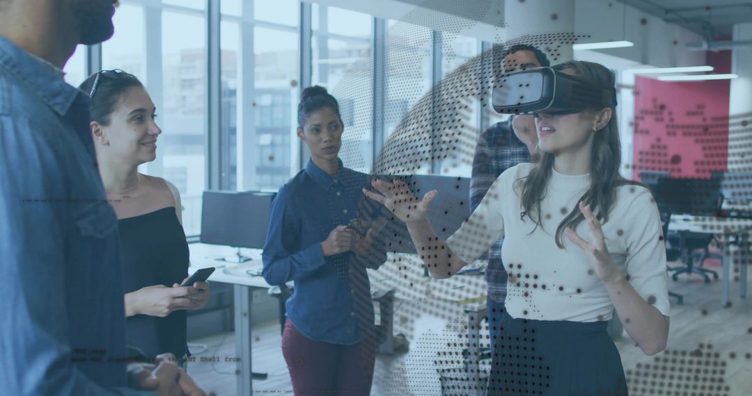 Creative team testing virtual reality headset for collaborative design in open office