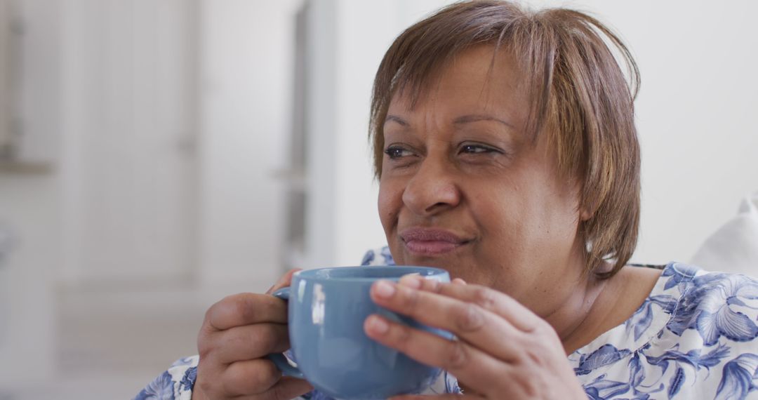 Senior Woman Enjoying Tea Moment at Home - Free Images, Stock Photos and Pictures on Pikwizard.com