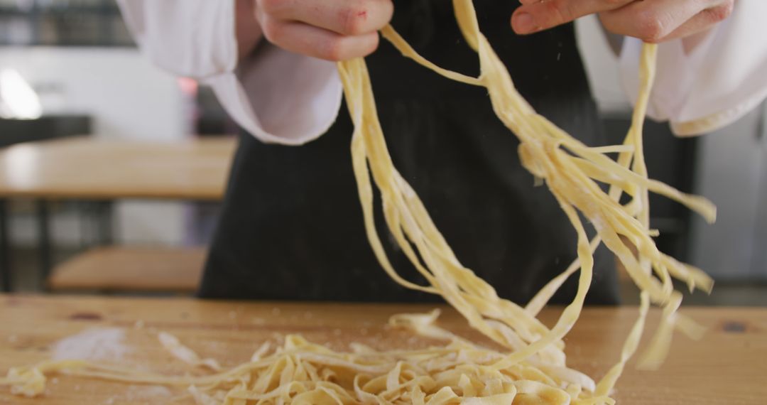 Chef Preparing Fresh Homemade Pasta in Rustic Kitchen - Free Images, Stock Photos and Pictures on Pikwizard.com