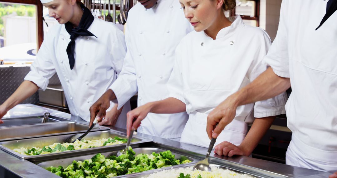 Chefs Preparing and Serving Steamed Vegetables in Professional Kitchen - Free Images, Stock Photos and Pictures on Pikwizard.com