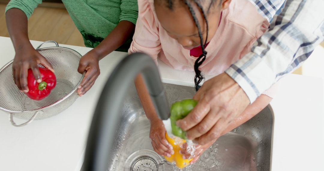 Family Washing Fresh Vegetables Together in Kitchen Sink - Free Images, Stock Photos and Pictures on Pikwizard.com